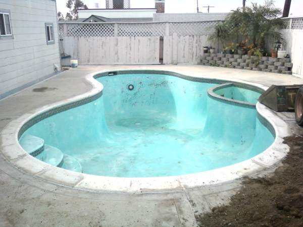 old pool in need a of pool removal from our swimming Pool Removal Contractors